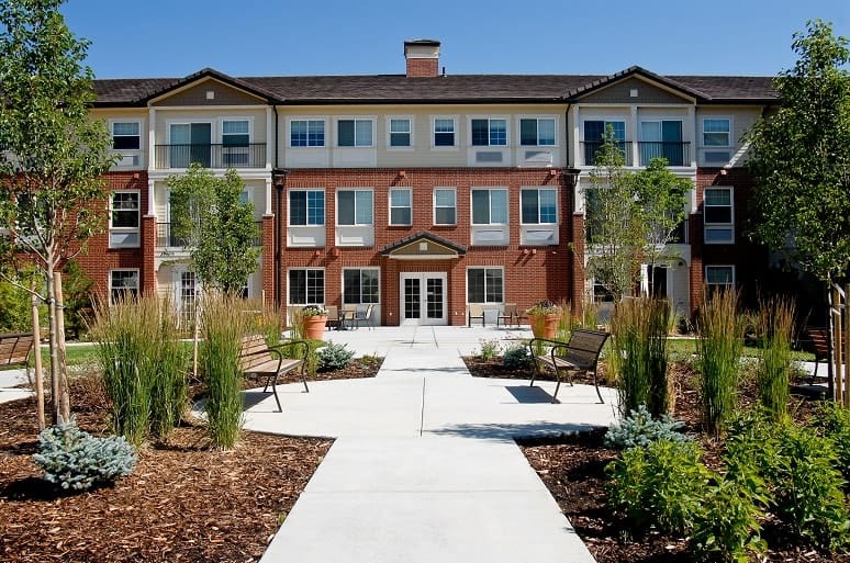 Exterior view of Lincoln Meadows Senior Living building and gardens