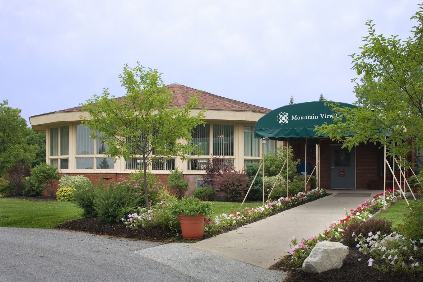 Exterior view of Mountain View Center entrance with greenery