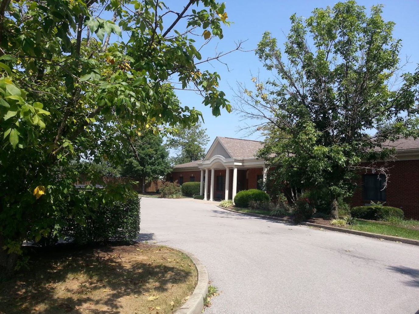 View of the entrance with landscaped surroundings