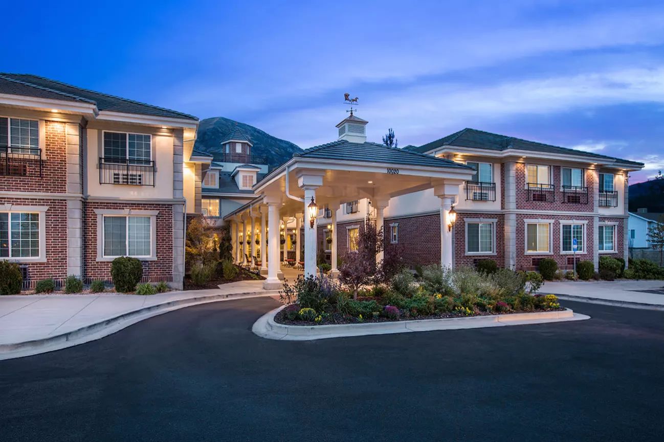 Entrance of a senior living facility at dusk