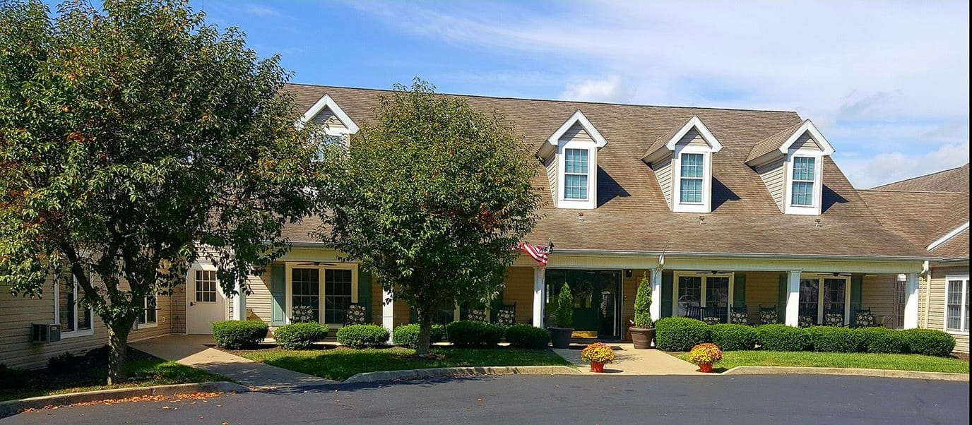 Front exterior view of Wyngate Senior Living with landscaping