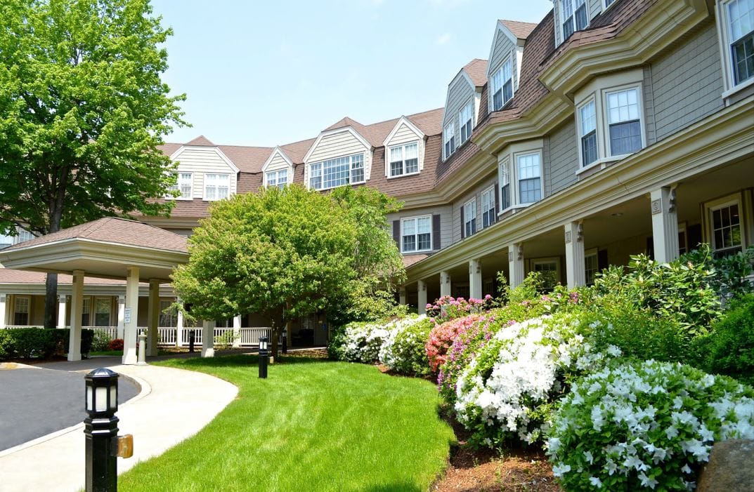Exterior view of Grove Manor Estates with gardens