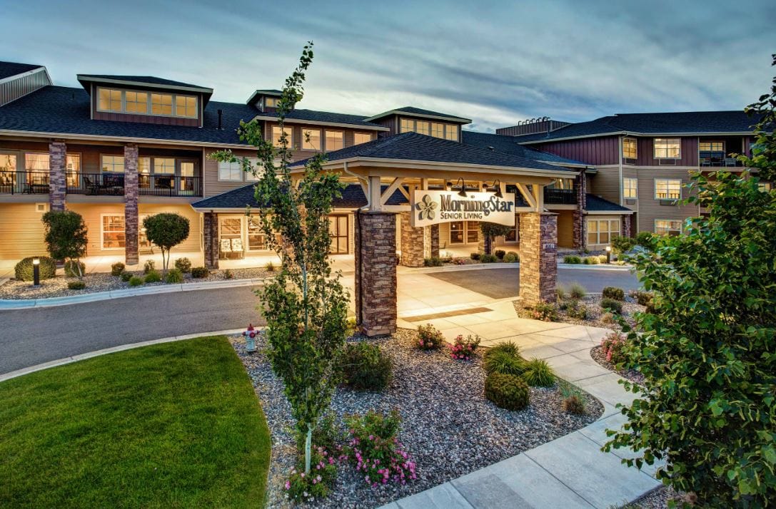 Exterior view of MorningStar Senior Living with landscaped entrance