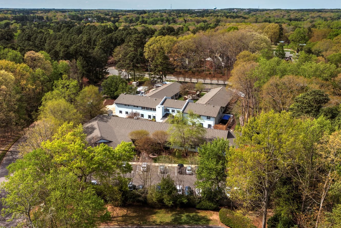 Aerial view of the TerraBella Northridge facility surrounded by trees