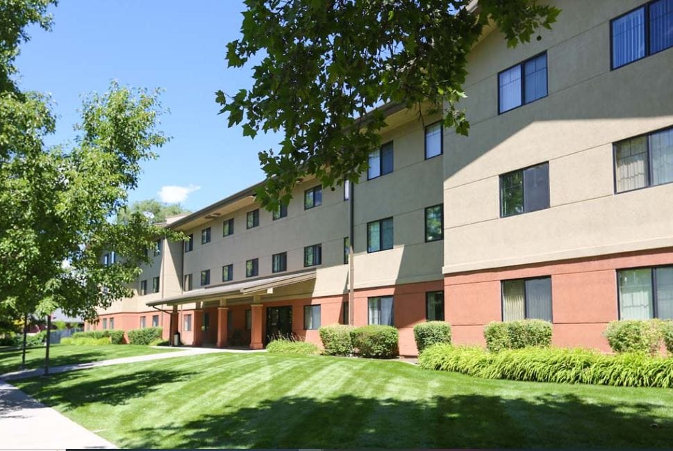 Exterior view of St. Joseph Senior Living facility with landscaped grounds