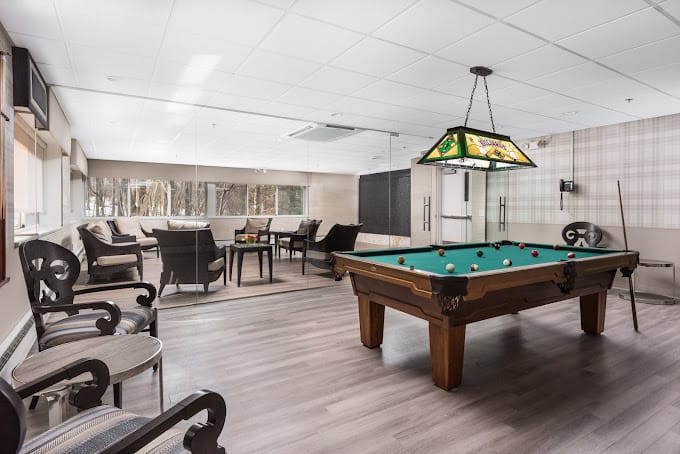Interior common area with a pool table and seating