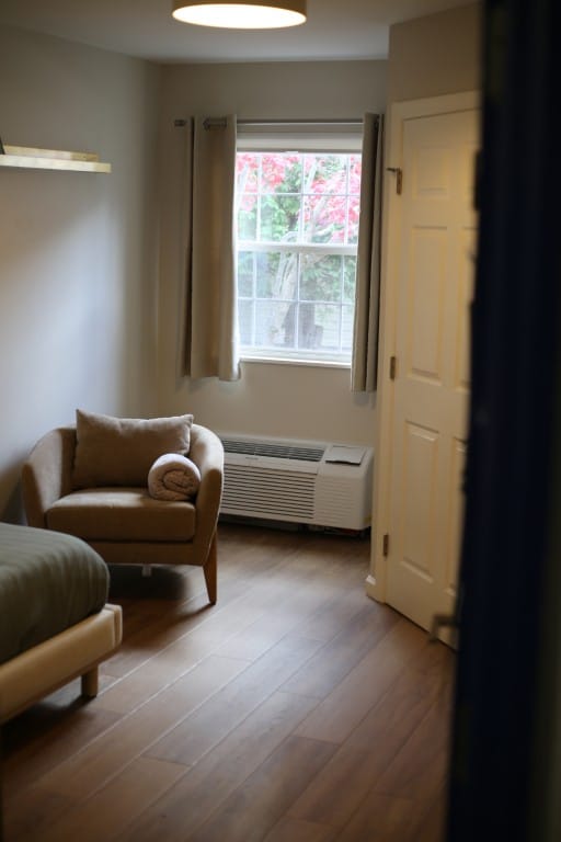 Cozy resident room with a chair and window view
