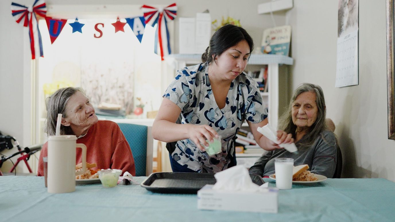 Windcrest Health and Rehabilitation, Nursing Home in Springdale, AR — Staff serving food to two residents in a dining area