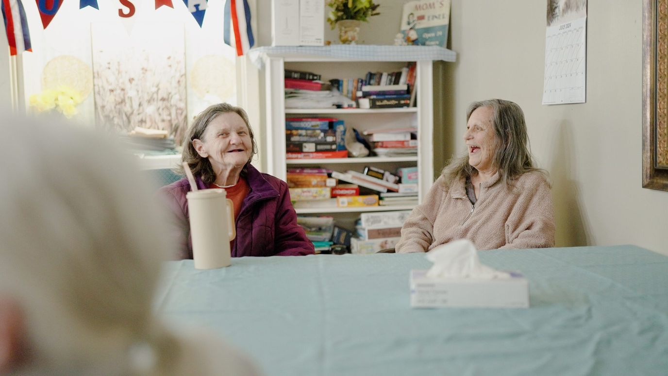 Windcrest Health and Rehabilitation, Nursing Home in Springdale, AR — Two women laughing together in a common area