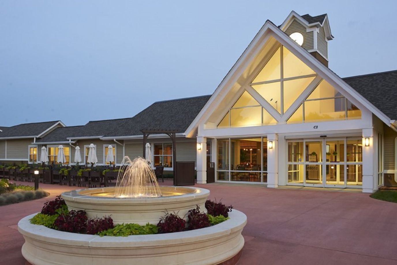 Front exterior of Fairwinds – Woodwark Park with fountain