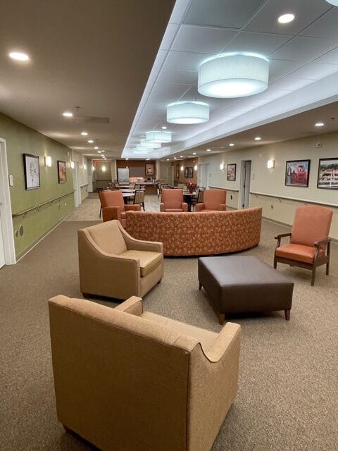 Common area with seating and tables in an activity room