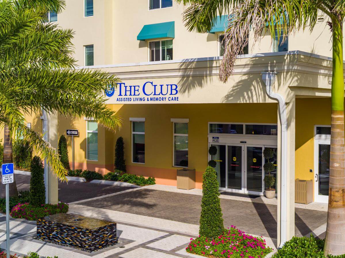 Exterior view of The Club entrance with landscaping