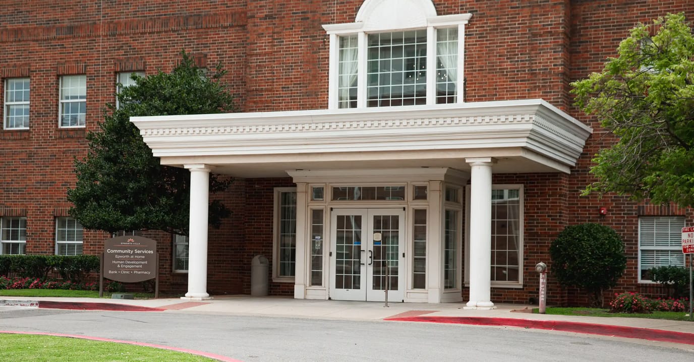 Exterior view of the community entrance with a covered porch