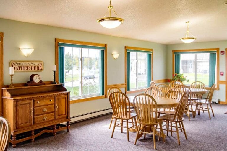 Bright dining area with wooden tables and chairs