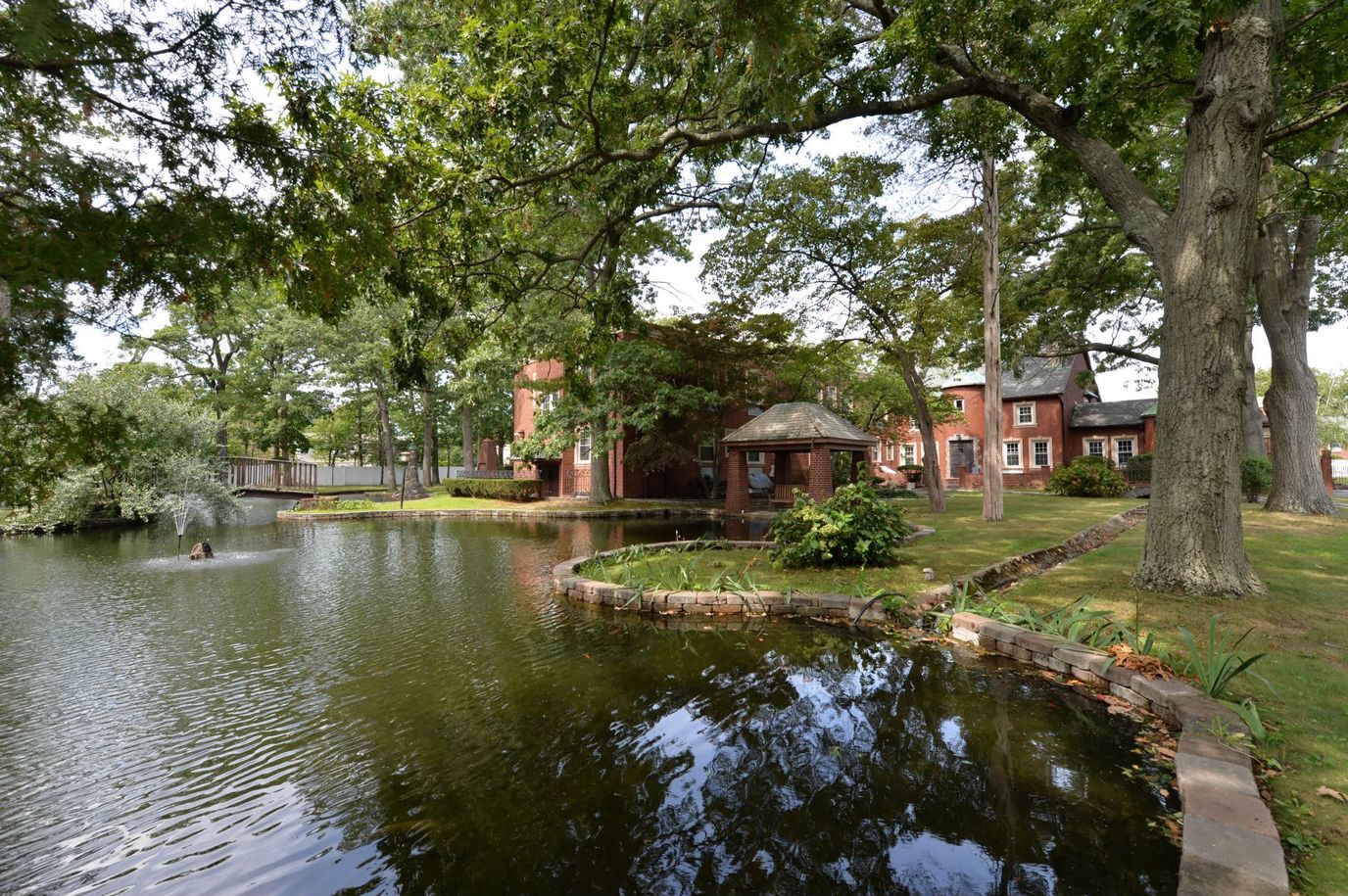 Exterior view of a facility by a pond