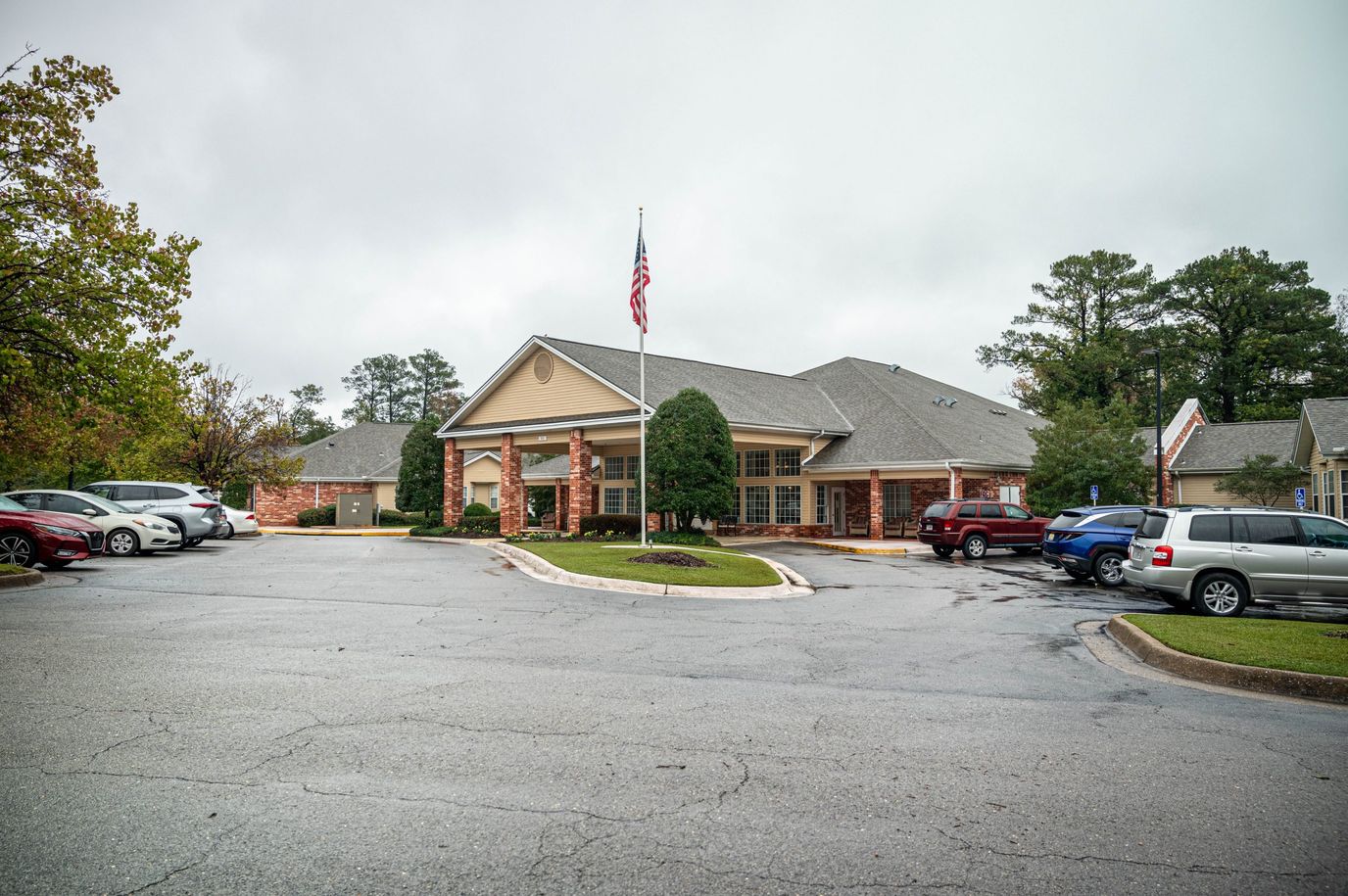 Exterior view of a senior living facility on a cloudy day