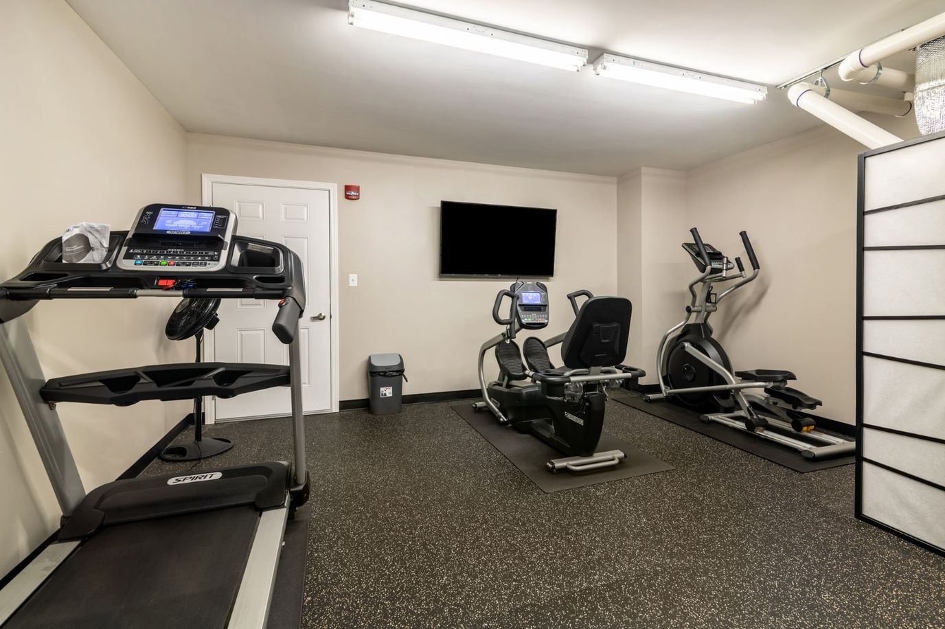 Connect55+ Concord, assisted living in Concord, NH — Fitness center with exercise equipment and television