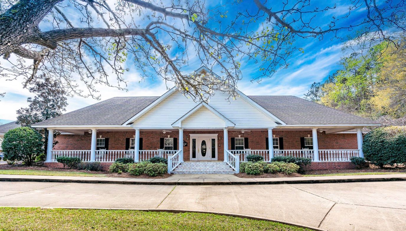 Sunny view of the Covington Ridge Retirement building entrance