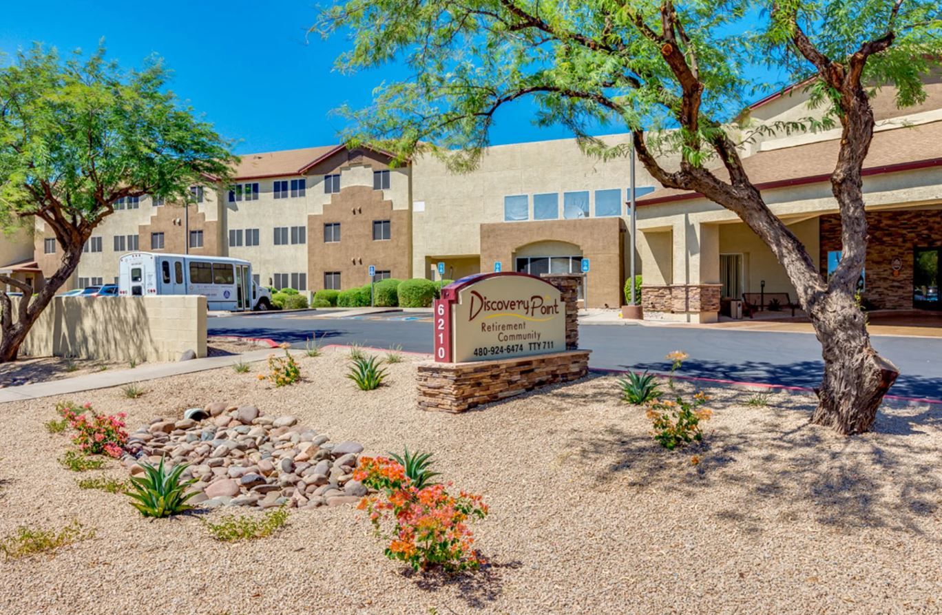 Exterior view of Discovery Point Retirement Community with signage