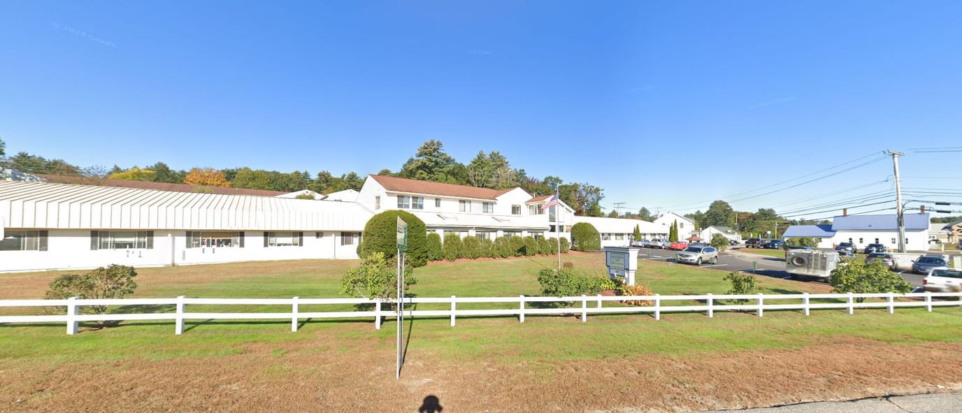 Exterior view of Epsom Healthcare Center with landscaped area