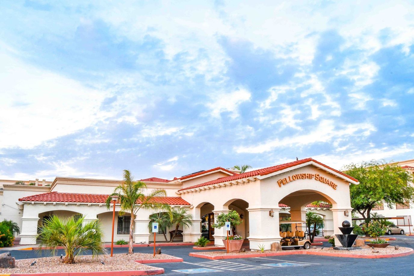 Exterior view of Fellowship Square with palm trees