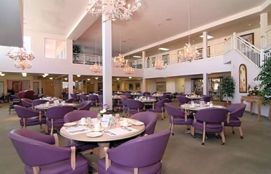 Dining area with elegantly arranged tables and chairs