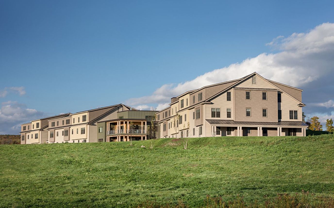 Exterior view of Menig Nursing Home surrounded by greenery