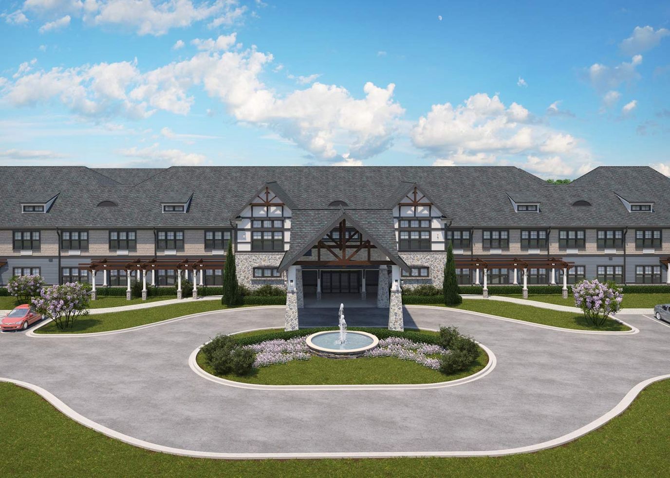 Exterior view of a senior living facility with fountain