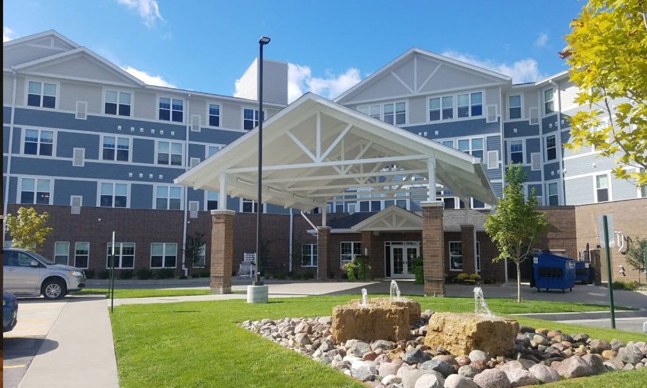 Exterior view of Overlook Village with entryway and landscaping