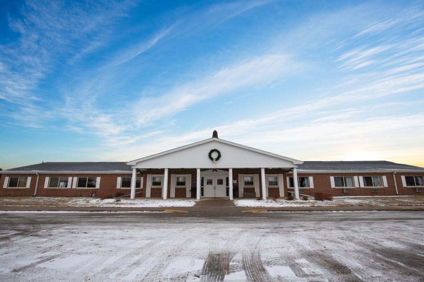 Front view of Prairie Heights Healthcare building under a blue sky