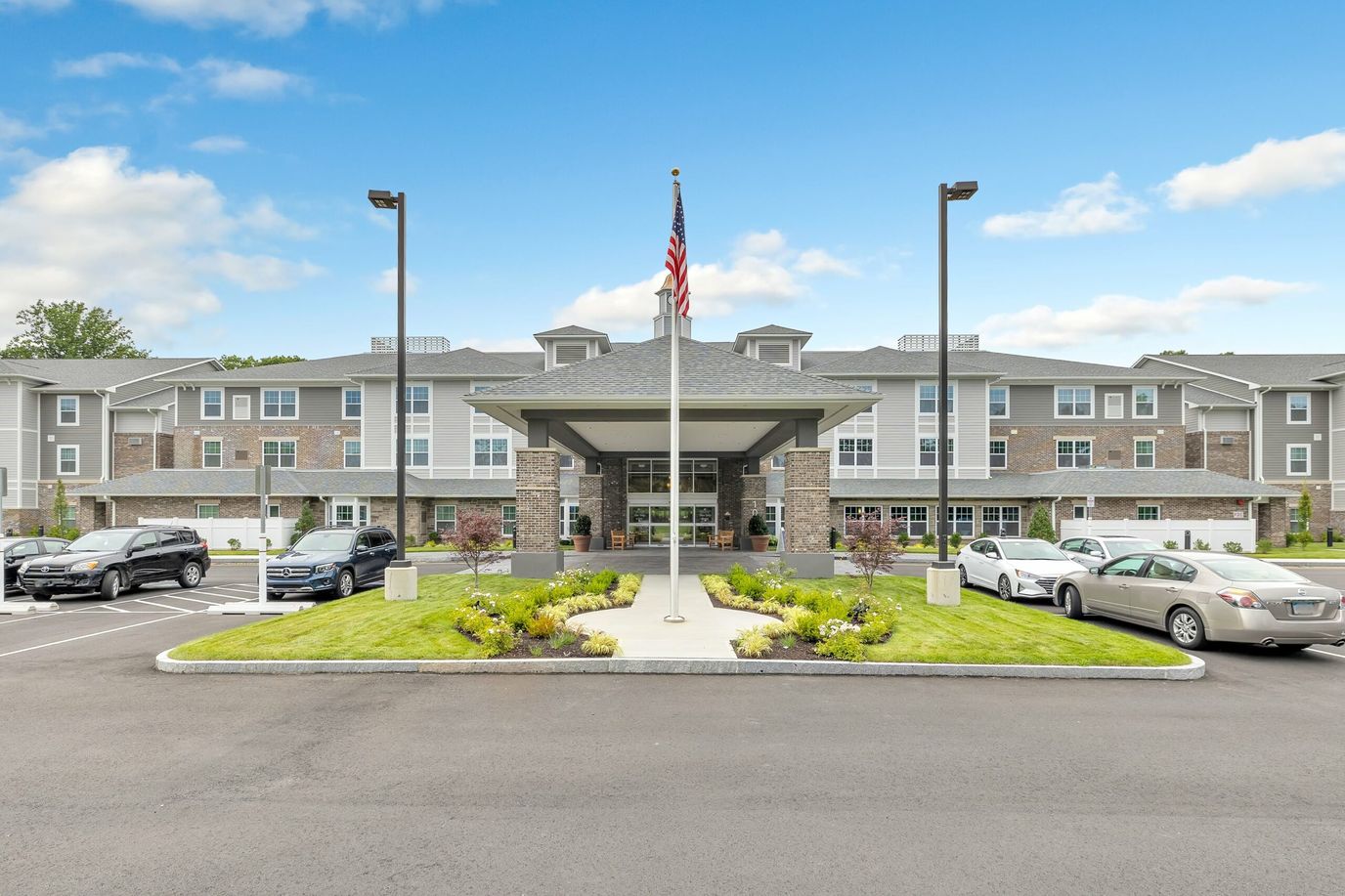 Front entrance of River Valley Retirement Community with landscaping
