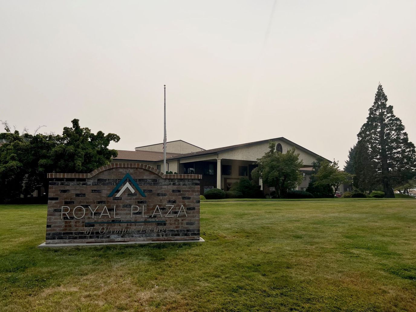 Front exterior of Royal Plaza building with sign