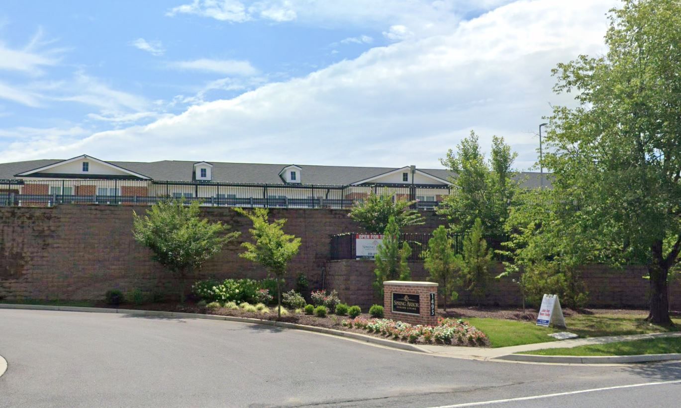 Exterior view of the assisted living facility with landscaping