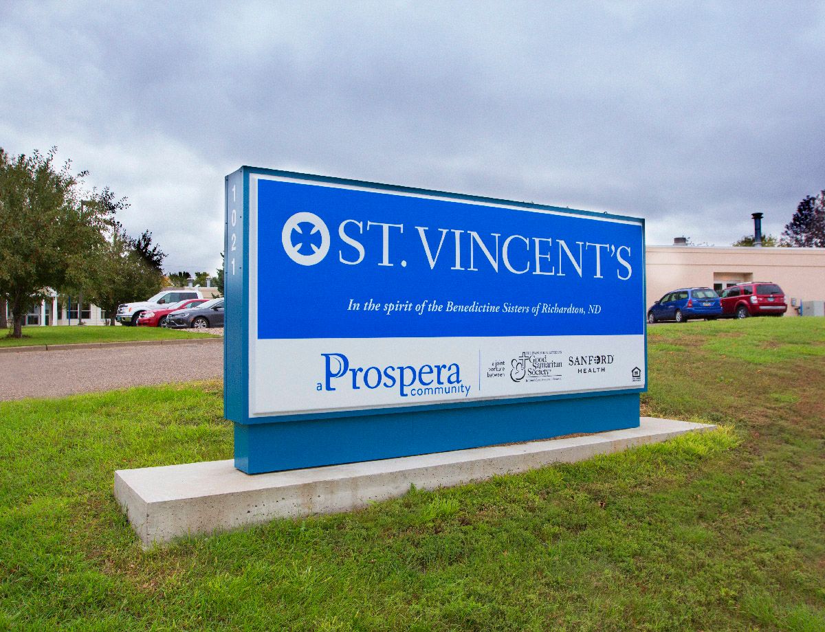 Exterior sign of St. Vincent's with a landscaped area