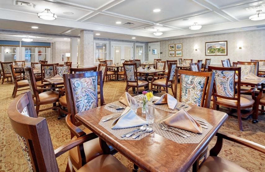 Dining area set up for a meal with elegant decor