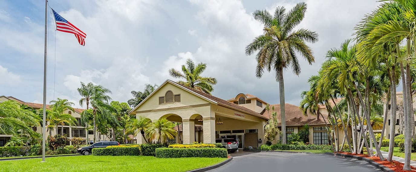 Exterior view of Waterside Landing with palm trees