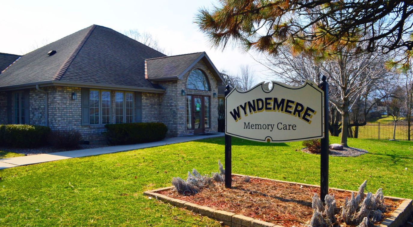 Exterior view of Wyndemere Memory Care facility with signage