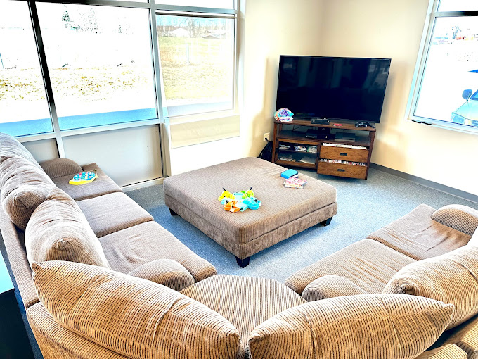 Cozy lounge area with a sectional sofa and television
