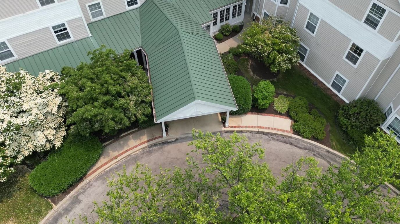 Aerial view of the facility entrance with landscaping.