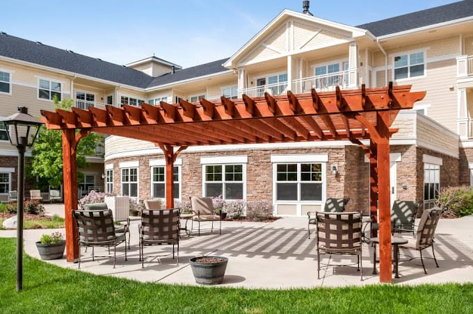 Outdoor seating area with pergola at assisted living facility