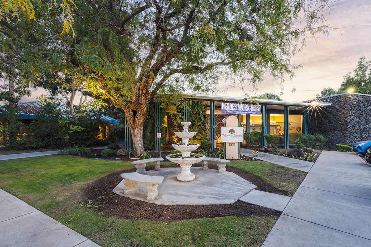 Exterior view of Oakwood Gardens Care Center with garden.