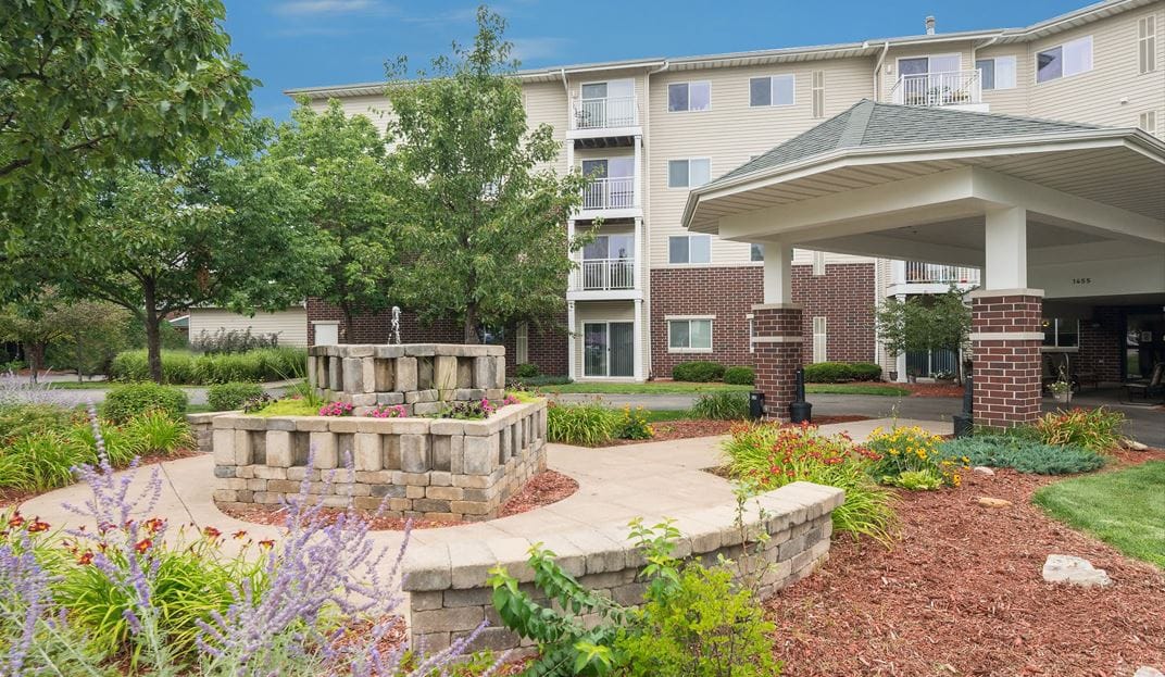 Outdoor view of the facility with landscaping and fountain