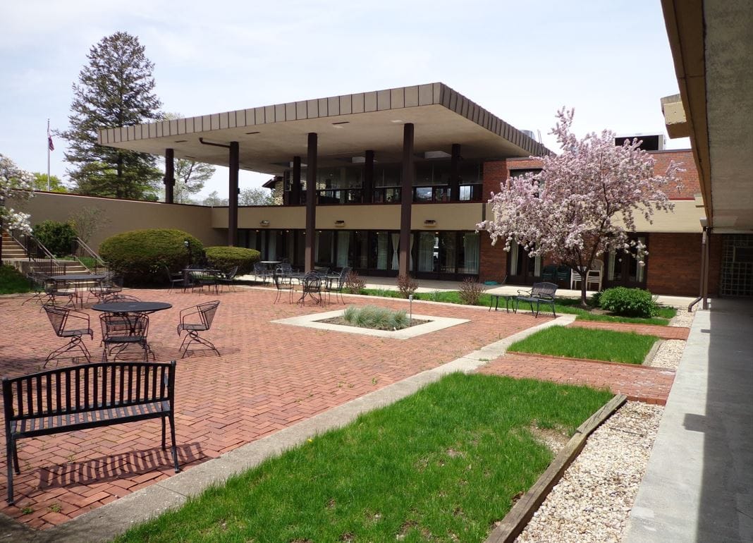 Outdoor courtyard with seating and flowering trees