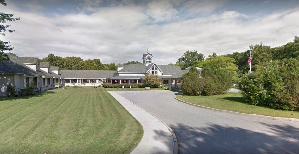Exterior view of Starr Farm Nursing Center with grassy areas