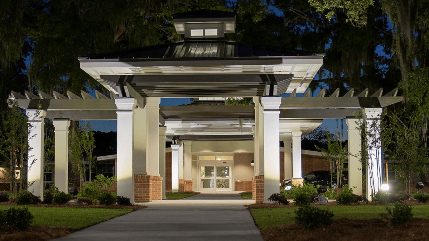 Exterior view of the facility entrance at night