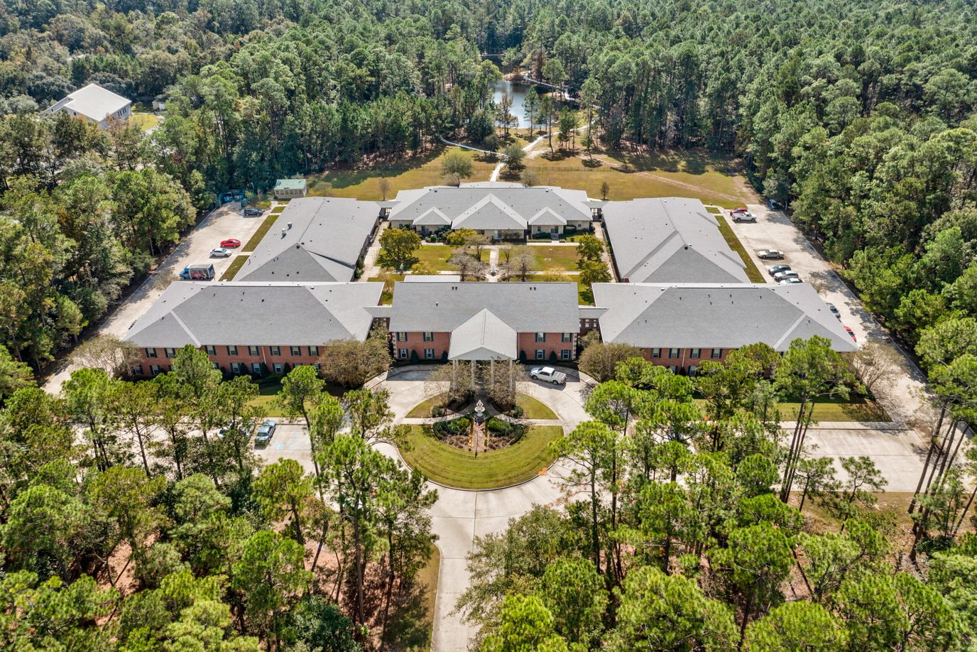 Aerial view of SummerHouse Bay Cove surrounded by trees