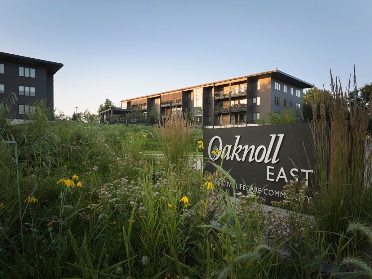 Exterior view of Oaknoll Retirement Residence with landscaping