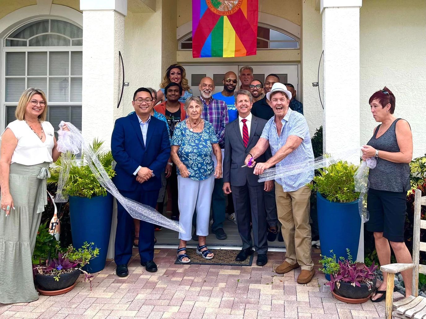 Residents and staff celebrating outside the facility