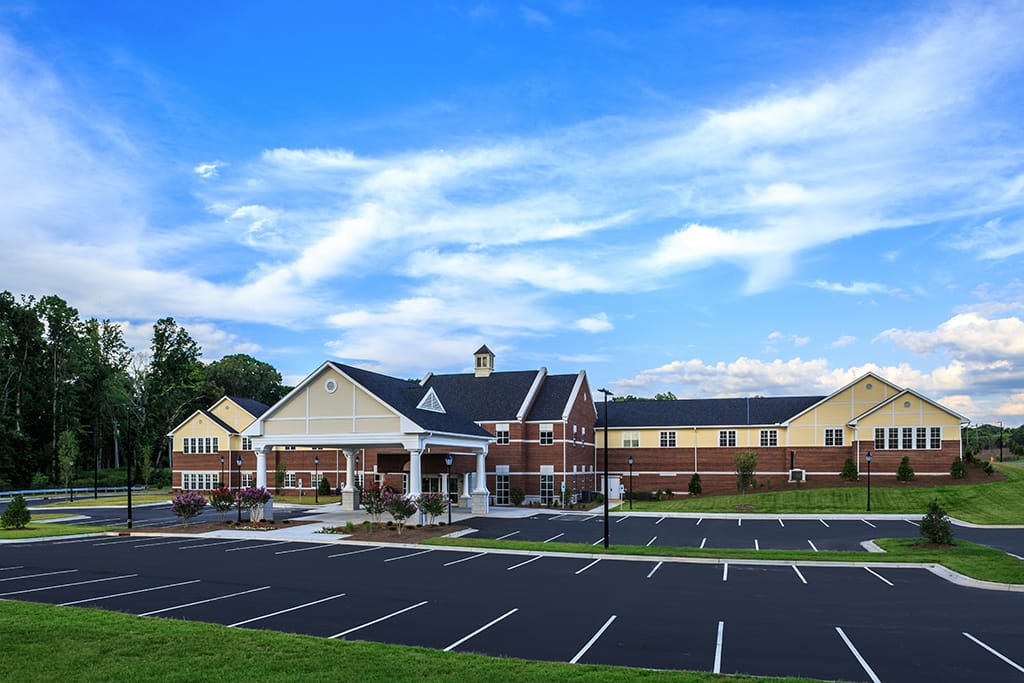 Exterior view of the assisted living facility with blue sky