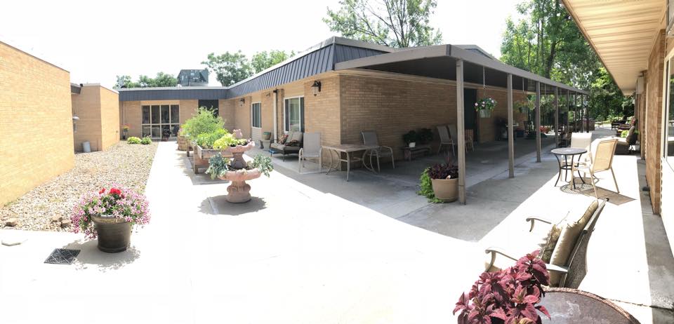 Outdoor patio area with seating and plants
